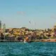 city buildings near body of water during daytime