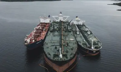 black and brown ships under cloudy sky