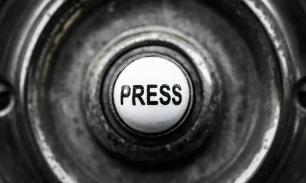 a button with the word press on it
