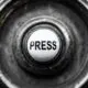 a button with the word press on it