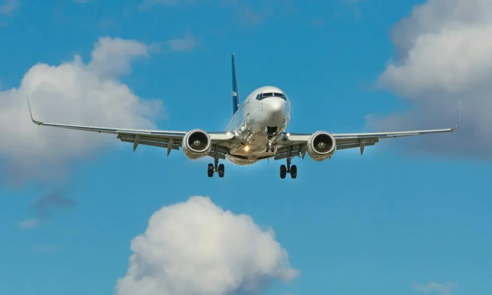 white airplane on mid air