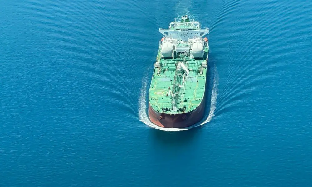 a large cargo ship in the middle of the ocean