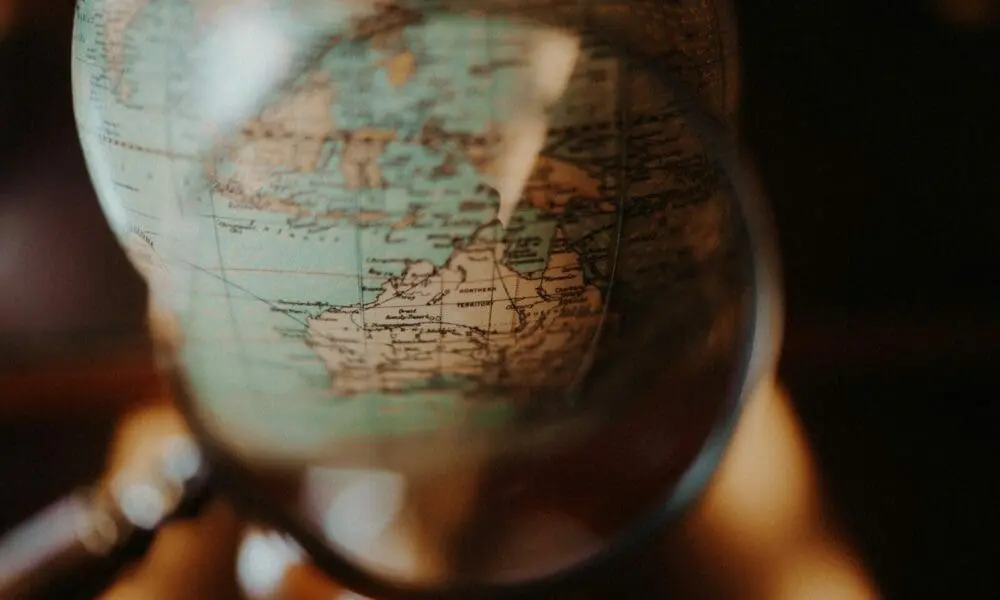 shallow focus photo of desk globe