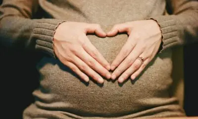 person holding belly photo