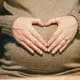 person holding belly photo