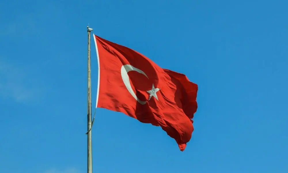 red and white national waving flag