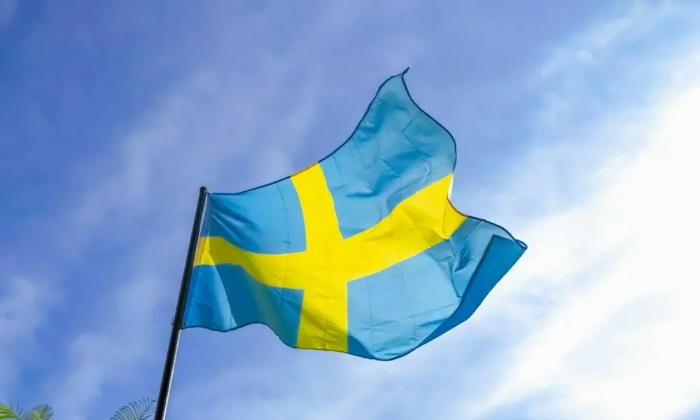 a blue and yellow flag flying in the sky