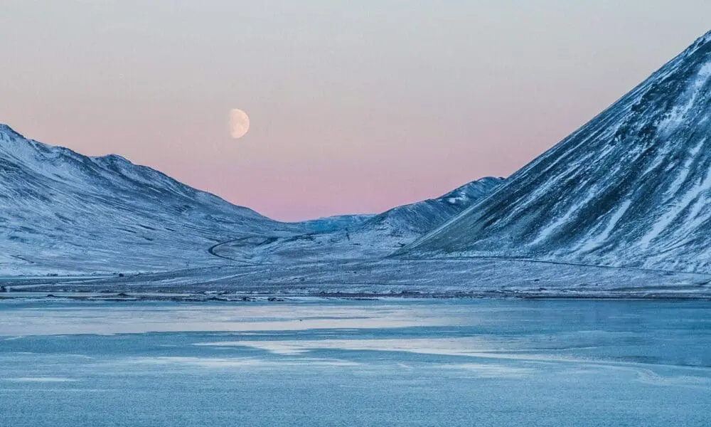 mountain near clear river