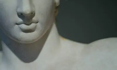 white concrete statue of man