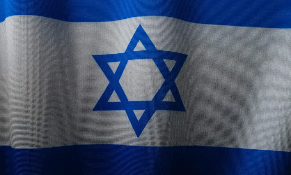 a close up of a flag with a star of david on it