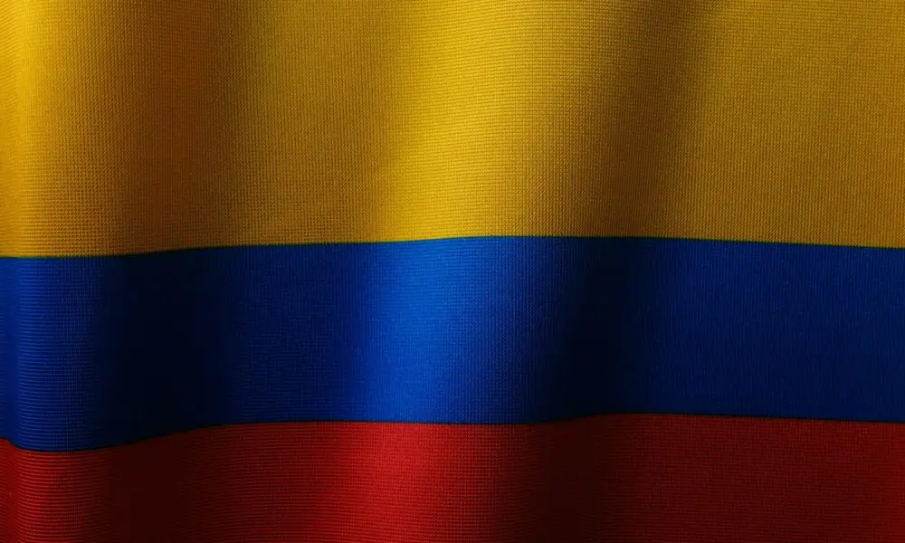 a close up of a red, yellow and blue flag